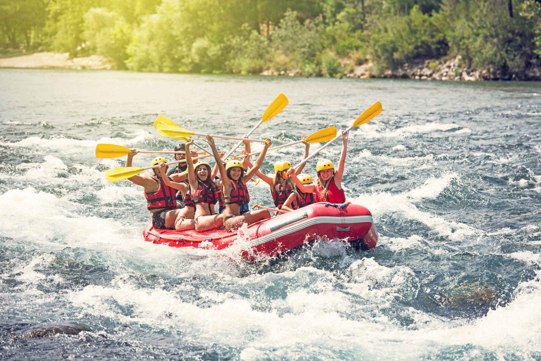 Group of people white water rafting